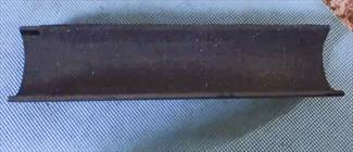 A photo of a piece of PVC cut lenghthwise
