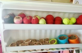 An open refrigerator showing many colorful food toys